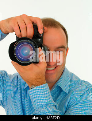 Avec un appareil photo reflex photographe Banque D'Images