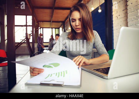 Portrait of a serious businesswoman using laptop in office Banque D'Images