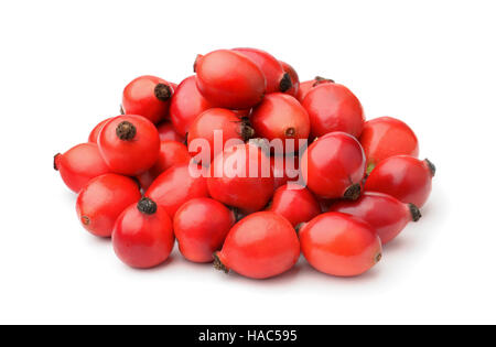 Pile de fresh rose hips isolated on white Banque D'Images