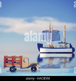 Petite voiture sur une surface en bois bleu et toy voilier en mer Banque D'Images