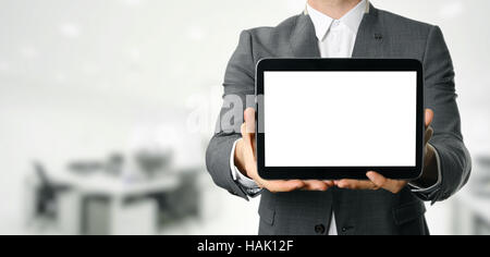 Businessman holding blank digital tablet with copy space in office Banque D'Images