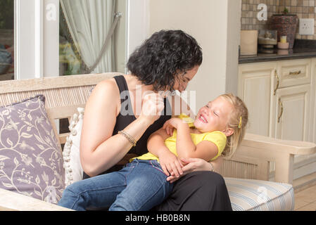 Mother and Daughter having fun on porch Banque D'Images