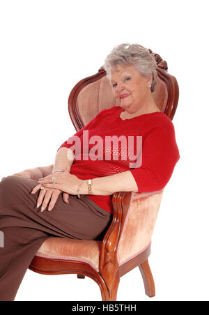 Ambiance senior woman sitting in armchair. Banque D'Images