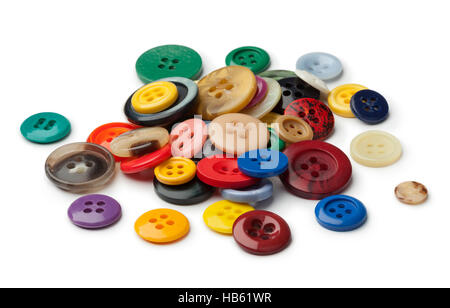 Tas de boutons de couture colorés sur fond blanc Banque D'Images