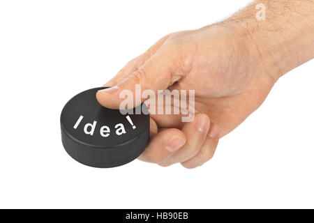 La main avec rondelle de hockey idée Banque D'Images