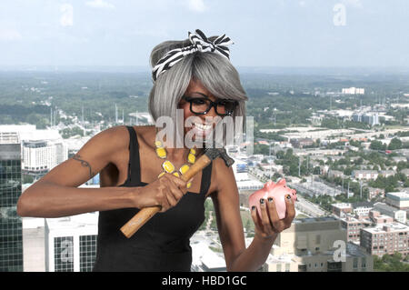 Woman holding piggy bank Banque D'Images