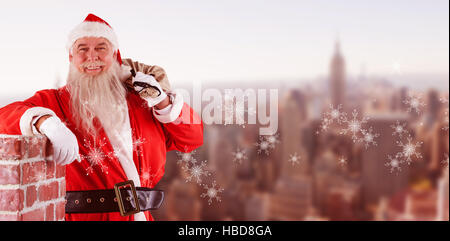 Image composite du portrait du père noël sac remplis de cadeaux Banque D'Images