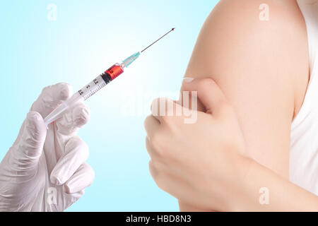 Hand holding a syringe Banque D'Images