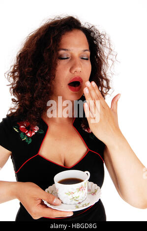 Tired woman holding Coffee cup. Banque D'Images