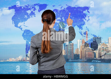 Businesswoman in global business concept Banque D'Images