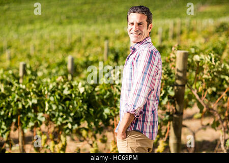 Portrait of male vintner standing with hands in pockets Banque D'Images