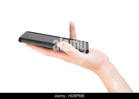 Woman hand holding smartphone. Vue de côté isolé sur blanc, chemin de détourage inclus Banque D'Images
