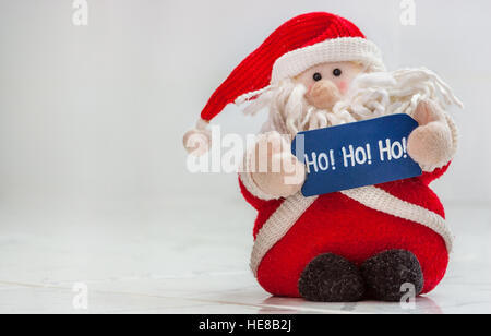 Peluche père noël hohoho holding sign Banque D'Images