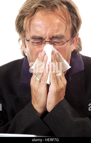 Homme avec un souffle froid son nez Banque D'Images