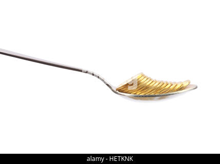 Pièce d'or avec cuillère en argent Banque D'Images
