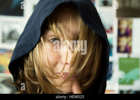 Portrait of young boy wearing hooded top Banque D'Images