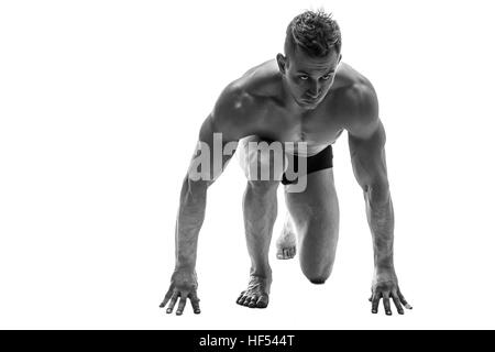 L'homme préparer pour courir. silhouette. isoler sur blanc. Photo en noir et blanc Banque D'Images