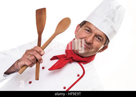 Chef holding cuillères en bois Banque D'Images