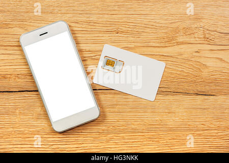 Smartphone avec écran blanc et de la carte SIM sur la table, vue du dessus Banque D'Images