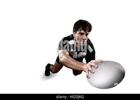 Joueur de Rugby dans un uniforme noir et blanc. Fond blanc Banque D'Images