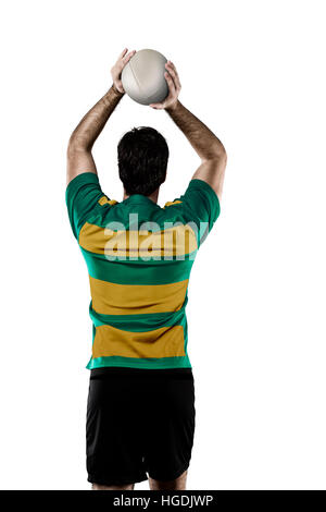 Joueur de Rugby dans un uniforme vert et or. Fond blanc Banque D'Images