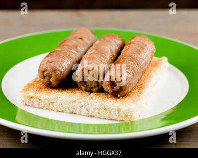 Porc cuit sur toast saucisses de petit-déjeuner Banque D'Images