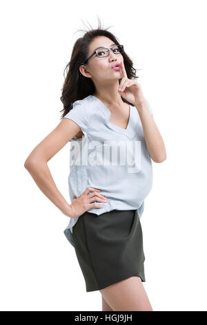 Happy young woman avec le doigt sur les lèvres Banque D'Images