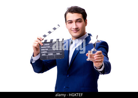 Bel homme avec movie clapper isolated on white Banque D'Images