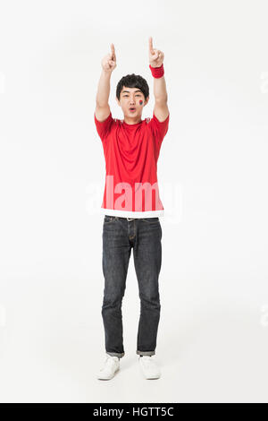 Jeune homme souriant cheerleader Coréen Banque D'Images