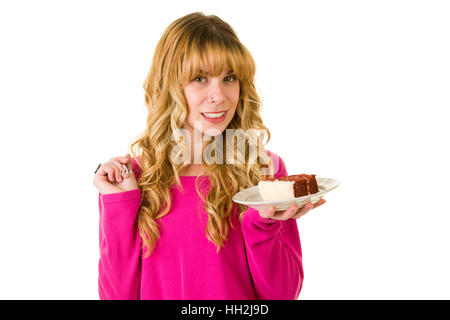 Une jolie blonde woman enjoying un morceau de gâteau Banque D'Images