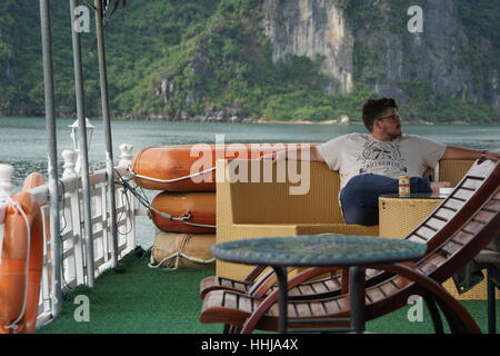 Man Relaxing on a Boat Banque D'Images