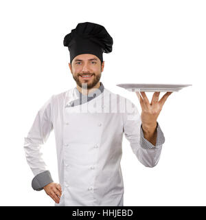 Chef holding plat vide isolé sur fond blanc Banque D'Images