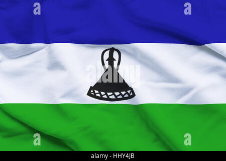 Ondulé et ridée drapeau national du Lesotho l'arrière-plan. Banque D'Images