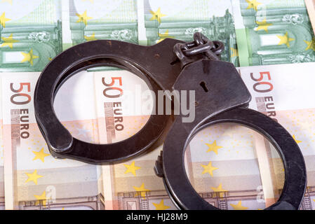 L'introduction des billets et des menottes Banque D'Images