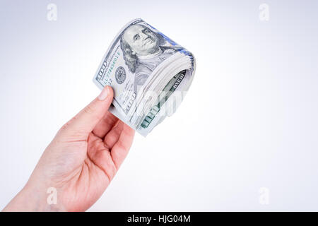 Human hand holding American dollar bill comme argent isolated on white Banque D'Images