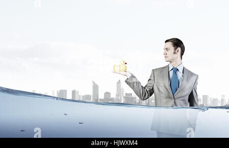 Funny businessman with yellow rubber duck toy Banque D'Images