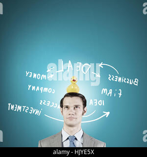 Funny businessman with yellow rubber duck toy Banque D'Images