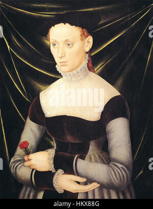 Ce portrait de Lucas Cranach l'ancien, intitulé « femme à l'œillet », est un bel exemple de la Renaissance nordique La femme est représentée dans une pose de trois-quarts de longueur, portant un col haut et un chapeau, tenant une fleur d'oeillet. La peinture souligne la texture détaillée et le symbolisme de la fleur, un motif récurrent dans les œuvres de Cranach. Banque D'Images