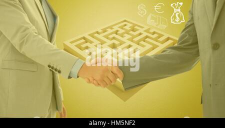 Businessman and woman shaking hands en dehors de labyrinthe avec les symboles de l'argent Banque D'Images