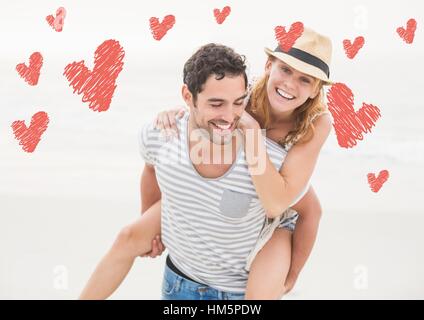 Happy man giving piggy back to woman Banque D'Images