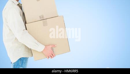 Mid section of delivery man holding cardboard box Banque D'Images