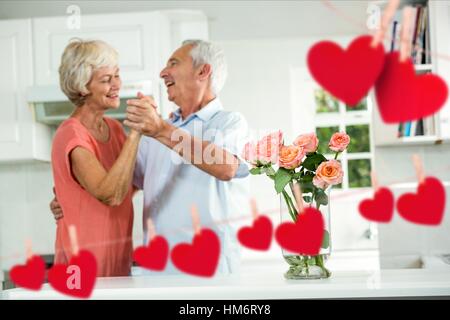 Senior couple dancing at home Banque D'Images