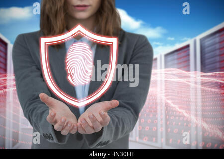 Businesswoman gesturing against white background contre composite image server towers Banque D'Images