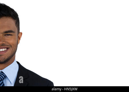 Smiling businessman standing against white background Banque D'Images