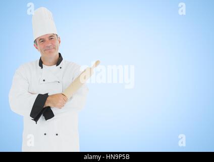Digital composite de chef avec rouleau à pâtisserie contre fond bleu Banque D'Images