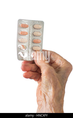 Senior woman hands holding medical pills isolated Banque D'Images