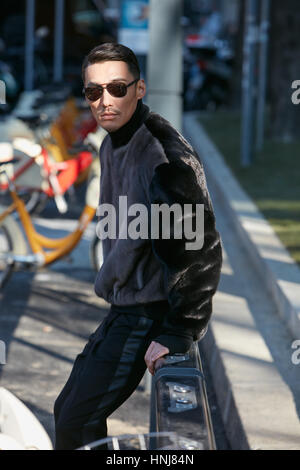 MILAN - JANUARY 15: Man with red tartan coat and red Supreme Louis Vuitton  bag before Represent fashion show, Milan Fashion Week street style on Janua  Stock Photo - Alamy