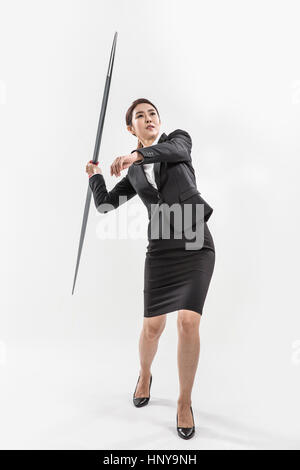 Businesswoman with javelin Banque D'Images