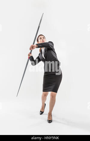 Businesswoman with javelin Banque D'Images