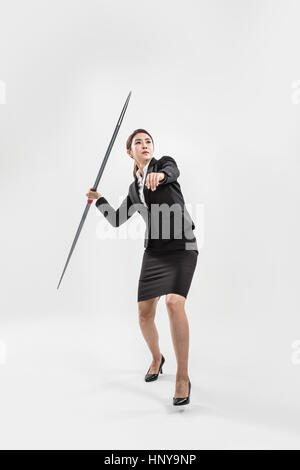 Businesswoman with javelin Banque D'Images